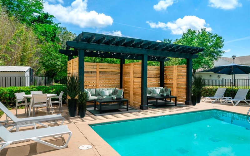 Resort-style swimming pool with lounge seat