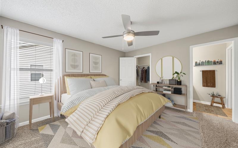 a bedroom with a bed and a fan